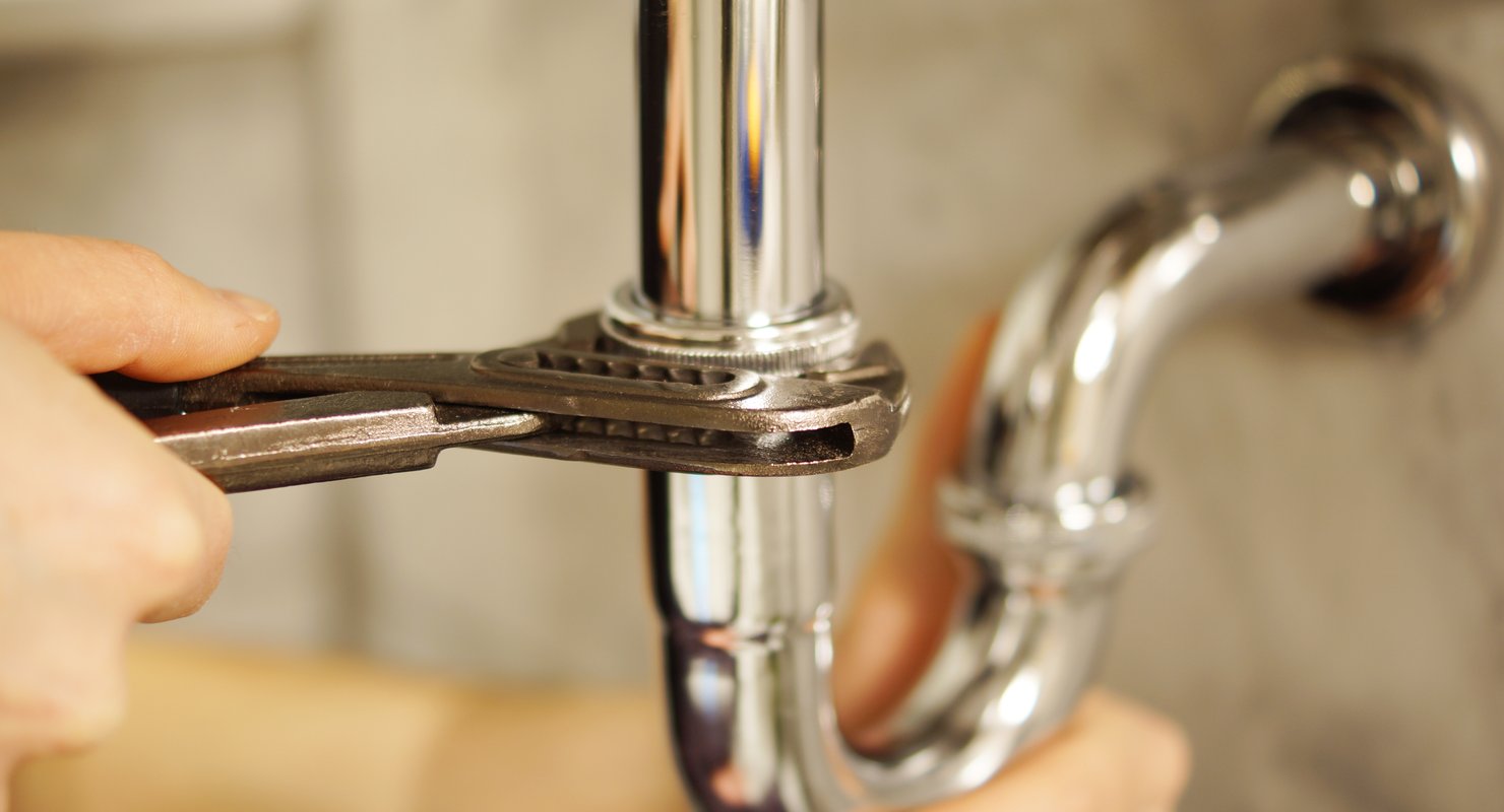 A plumber on a job due to his high performance website made by Test Valley Digital generating him leads.