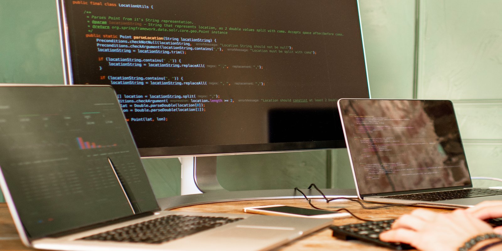 An array of laptops showing code