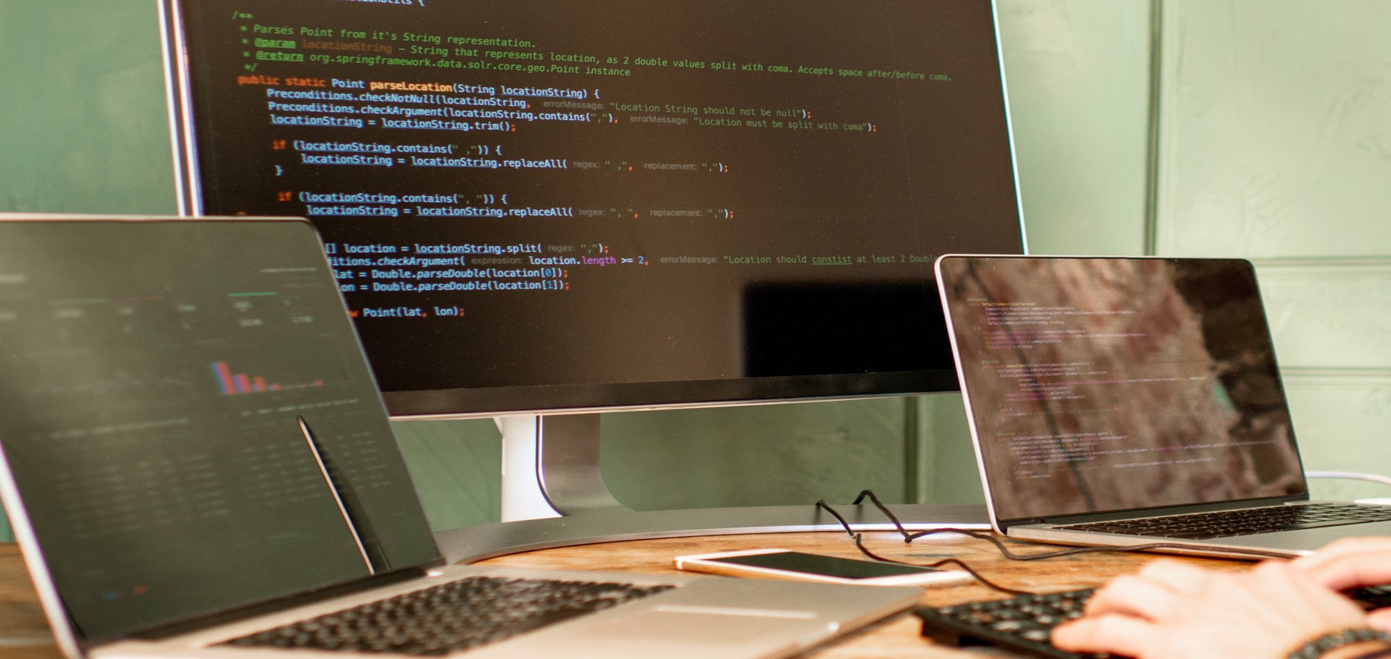 An array of laptops showing web development code